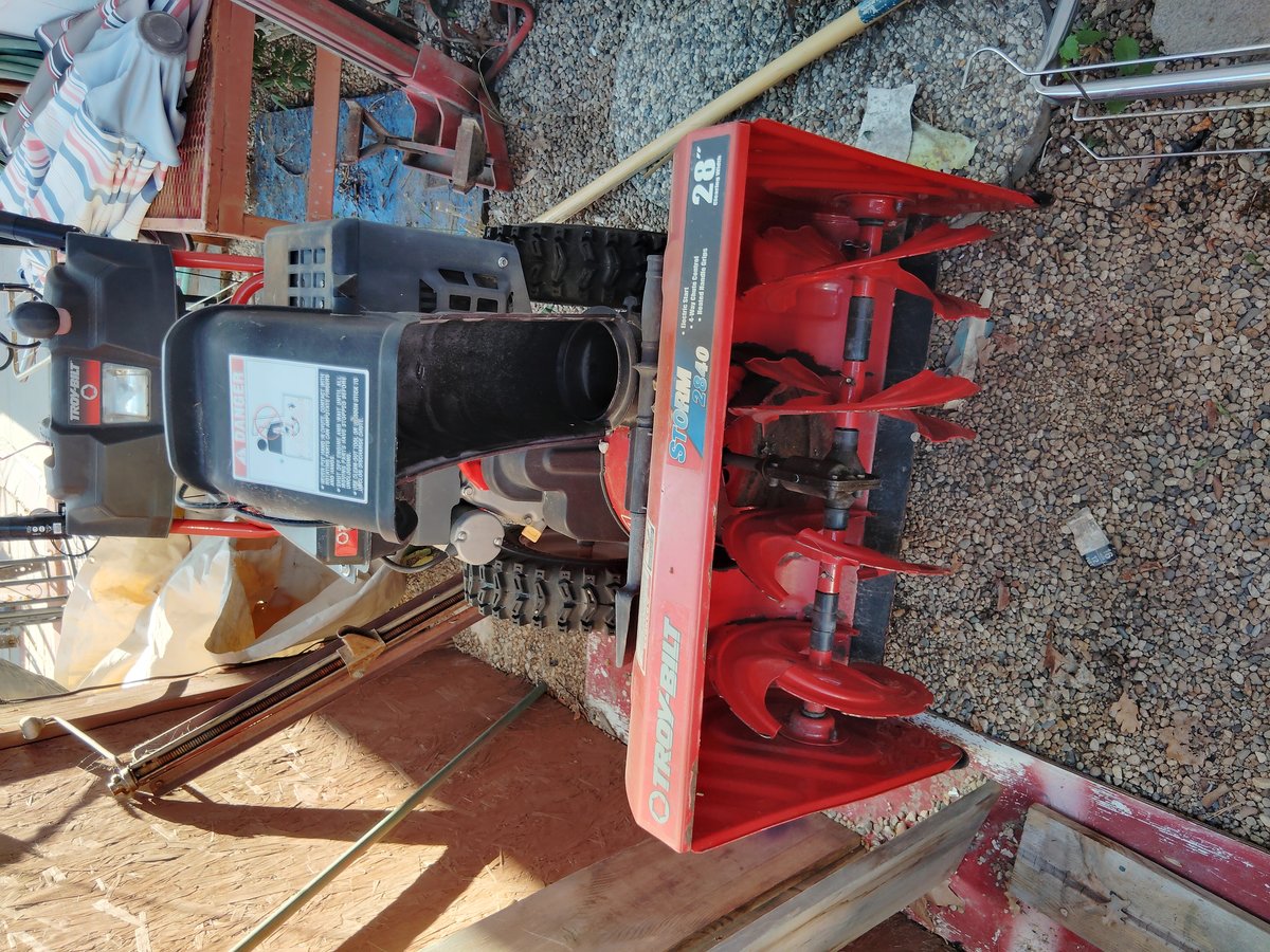 Red snow blower used good condition outdoors