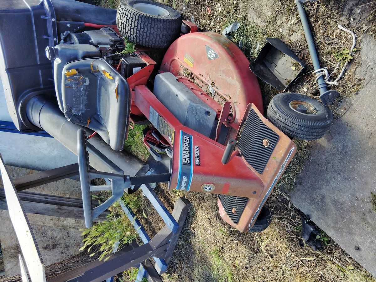 Red riding mower needs repair parts missing worn